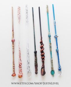 seven different colored hair ties lined up on a white surface with the words wetsy com / shop / justalevel