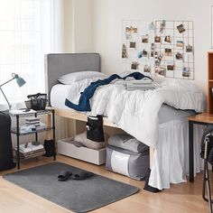 an unmade bed sitting on top of a wooden floor