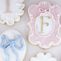 decorated cookies with the letter f on them are arranged in different shapes and sizes, including one cookie