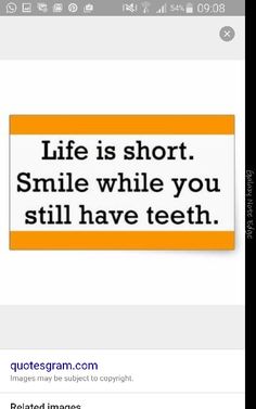 an orange and white sign that says life is short smile while you still have teeth