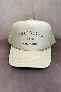 COLOR: Sand The Encinitas Trucker hat is the perfect way to show pride in your favorite city! Featuring a classic Encinitas, CA printing, mesh back, foam cap and adjustable snapback. DETAILS + CARE: 100% Polyester One size fits most Designed in Ventura, CA Jesus Wallpaper, Color Sand, Instagram Tags, Cap Design, Favorite City, Clothing Ideas, Color Khaki, Trucker Cap, Apparel Accessories