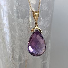 Details: Lovely vintage amethyst pendant and 14K gold necklace. The amethyst is faceted, and has an amazing sparkle glow. The amethyst measures 15.19 x 19.67 x 10.37mm, and is roughly 14.5 carats. This pendant is sold with a 14K gold chain, and the chain is modern. Please ask all necessary questions prior to placing an order! Size: The chain measures 16 inches, and the pendant is 1 1/4 inches. Condition: The overall all condition of this piece is very good. Purple Drop Necklace For Formal Occasions, Formal Purple 14k Gold Necklace, Formal Purple Drop Necklace, Formal Drop Amethyst Necklaces, Formal Amethyst Drop Necklace, Formal Drop Amethyst Necklace, Large Locket, Festoon Necklace, Filigree Ring Gold