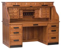 an old fashioned wooden desk with drawers and cupboards on it's top shelf