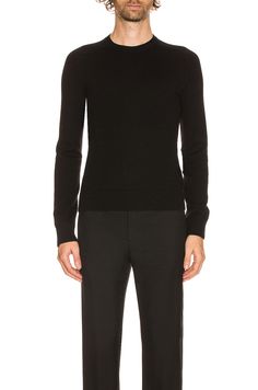 Find SAINT LAURENT Crew Neck Sweater on Editorialist. Saint Laurent Crew Neck Sweater in Black 100% cashmere. Made in Italy. Hand wash. Lightweight knit fabric. Rib knit trim. SLAU-MK27. 603089YALL2. About the designer: SAINT LAURENT has been influencing and revolutionizing the fashion industry since the debut of its iconic ‘Rive Gauche’ collection in 1966 - the couture house was the first to create a ready-to-wear capsule. The sleek, precisely tailored staples, like the signature biker jackets, transcend seasons and trends. Creative Director Anthony Vaccarello continues to honor the label’s illustrious reputation by reintroducing cult styles, including the ‘Lou’ handbag and ‘Tribute’ sandals. Luxury Fitted Crew Neck Sweater, Black Cashmere Sweater For Formal Occasions, Designer Fitted Crew Neck Sweater, Luxury Fitted Sweater With Ribbed Cuffs, Black Fitted Luxury Sweater, Luxury Fitted Black Sweater, Luxury Black Fitted Sweater, Designer Cashmere Fine Knit Sweater, Designer Black Fitted Sweater