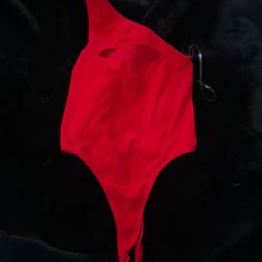 Cut Out Piece On Top Of Chest, Size M/L, Very Stretchy Material, Very Flattering, Nwot, Red In Color, Buttons At The Bottom Making It Easy To Come Off! Red Beachwear Bodysuit With Lined Body, Red Lined Bodysuit For Beachwear, Red Sleeveless Bodysuit For Club, Red Sleeveless Swimwear For Party, Red Sleeveless Party Swimwear, Red One-piece Swimwear For Night Out, Red Party Swimwear For Spring, Trendy Red Bodysuit For Beach, Red Lined Bodysuit For Spring