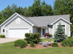 a house with landscaping in front of it