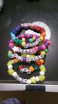 several bracelets with words written on them