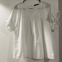 White Ruffle Sleeve Top White Flowy Blouse With Ruffle Sleeves, White Blouse With Ruffle Hem And Flutter Sleeves, White Ruffled Blouse For Daytime, Daytime Ruffled Short Sleeve Blouse, White Ruffle Sleeve Top, Yellow Halter Top, Heart Blouse, Black Cami Top, Satin Crop Top