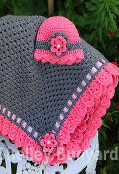 a crocheted hat with flowers on it