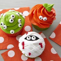 three cupcakes decorated to look like monsters