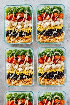 four glass containers filled with different types of salads and toppings on top of each other