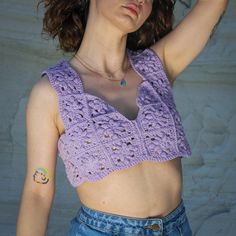 This crochet halter crop top combines sustainability and comfort. Bralette top offers an eco-friendly and stylish choice. Flower stitch details gracefully adorn the top, adding a touch of dynamic charm. Festival crop top is the perfect selection not only for those who appreciate style, but also for those with a penchant for the extraordinary. 📌 Flower Stitch Detail 📌 Soft Purple Color 📌 Premium quality knit 📌 %100 handmade 📌 Specially curated for you. 🎁 Worldwide fast and free shipping. This handcrafted knit top harmoniously merges sustainability and elegance. 🌱 Sustainability: In line with sustainability principles, this top was meticulously designed. Natural yarn threads offer an eco-conscious alternative. By wearing this piece, you can leave a positive impact on the world while e Fitted Crochet V-neck Crop Top, Fitted Knit Crop Top With Crochet Lace, Fitted Knit Crochet Lace Crop Top, Fitted Crochet Lace Knit Crop Top, Sleeveless Crochet Lace Knit Crop Top, Spring Crochet Crop Top, Stretch Knit Cropped Crochet Top, Stretch Cropped Knit Crochet Top, Sleeveless Stretch Crochet Crop Top