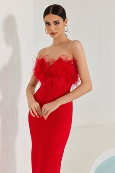 This Diaz Feather Tassel Maxi Dress offers an exclusive fashion statement in an elegant bandage fabric. Its strapless design and ankle-length hem are enhanced with feather accents for a tasteful, sophisticated look. Perfect for special occasions, this classic dress will be sure to turn heads.

Material: Bandage (90% Rayon, 9% Nylon, 1% Spandex)
Made from stretch bandage fabric, that is made to contour, shape, and flatter your body
Model Stats: Height - 69.6"/177cm Bust - 34.2"/87cm Hips - 35.8"/ Off-shoulder Feather Trim Cocktail Dress, One-shoulder Feather Trim Dress, Red Feathered Evening Dress, Red Feather Trim Evening Dress, Elegant Feather-embellished Dresses, Denim Style Casual, Tassel Dress, Eyelet Lace, Type Of Pants