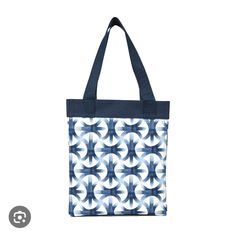 a blue and white tote bag on a white background