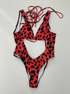 Red Trendy Swimwear For Vacation, Trendy Red Bodysuit For Beach, Red Backless Swimwear For Summer, Red Backless Swimwear For Beach Party, Trendy Red Swimwear For Vacation, Red Halter Neck Swimwear For Vacation, Red One Pieces For Spring Vacation, Casual Red Bodysuit For Vacation, Trendy Red Swimwear For Summer