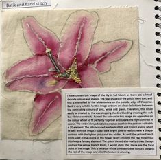 a piece of paper with an image of a pink flower on it and text underneath