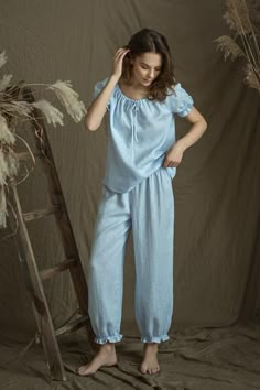 Our new bohemian look pajama - just for your beauty.So cute and feminine look - the ruffles on sleeves and pants create the lightness and softness.Pajama top  drawstringed at neck line and at bottom, reglan short sleeves.Delicate white linen tape decorates short sleeves bottom and front center line.This youthful, beautiful and simple style - for your good and comfy sleep.Top center back length - 38cm ( 15").Pajama bottoms - loose bloomers - gathered with narrow elastic at bottom and with delicat Loose Pajama Outfit, 3 Piece Night Wear For Women, Sleep Wear For Women Nightwear, Fantasy Pajamas, Cute Summer Pyjamas, Playful Blue Sleepwear For Spring, Blue Playful Sleepwear For Lounging, Feminine Pajamas, Feminine Sleepwear