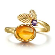 Beautiful flower ring with a stunting natural cabochon citrine and amethyst round stone; featured in sterling silver with a heavy gold plating. Gold Birthstone Ring With Natural Stones, Elegant Gold Amethyst Cabochon Ring, Elegant Citrine Rings With Natural Stones, Gold Amethyst Ring With Cabochon Cut, Gold Topaz Crystal Ring, Gold Amethyst Ring With Natural Stones As Gift, Gold Amethyst Open Ring Fine Jewelry, Gold Rings With Natural Stones And Citrine, Gold Amethyst Crystal Ring With Gemstone