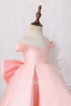 For a princess look with a dash of delicacy, this adorable baby pink satin Off-shoulder Big Bow Designer Structured High Low Flower Girl Dress features off-the-shoulder bodice with lace-up back and a pretty removable big bow. The puffy high-low skirt provides more structure and fashion. shown color baby pink lining fully lined length high-low closure lace-up Cute Pink Off-shoulder Dress, Satin Princess Dress With Bow, Elegant Pink Satin Princess Dress, Pink Fitted Satin Princess Dress, Pink Princess Dress With Satin Bow For Party, Pink Wedding Dresses With Bow Straps, Pink Satin Princess Dress, Pink Satin Dress With Satin Bow, Pink Princess Dress With Bow For Pageant