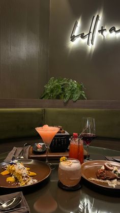 plates of food and drinks on a table in front of a sign that reads lifta