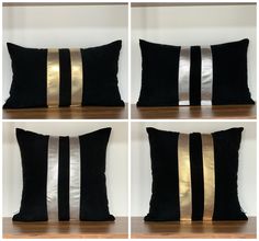 four black and white pillows with gold stripes