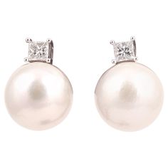 the 14mm. white pearls to brilliant-cut diamond surmounts, diamonds approx. 0.45ct. total Diamond Earrings Stud, Amazon River, Pearl And Diamond Earrings, Earrings Stud, South Seas, Pearl Diamond, Cultured Pearls, Diamond Earrings Studs, Brilliant Cut Diamond