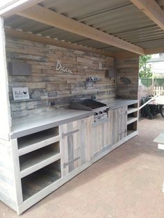 an outdoor kitchen made out of pallet wood