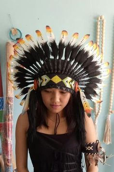 White Orange & Black Feather Indian Headdress This Headdress is 100% handmade from feathers. * Head circumference: 59 centimeters / 23 inches * Length : Short * Beads color and pattern may vary each headdress WHY US? * 100% Handmade and Eco Friendly Product * Finest Quality - Each item will go through a Quality Control process before shipping. * No Markup Price * Every purchase supports Balinese Artisans - All Artisans will keep on following their passions while providing for their families. Black Summer Hats With Feather Trim, Summer Black Hats With Feather Trim, Black Summer Hat With Feather Trim, Ceremonial Black Adjustable Headpieces, Adjustable Black Ceremonial Headpiece, Adjustable Black Feather Headpiece, Adjustable Black Feathered Headpiece, Adjustable Black Headpieces For Festival, Black Headpiece For Carnival Festival