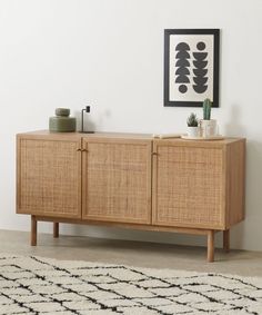 the sideboard is made out of wood and wicker