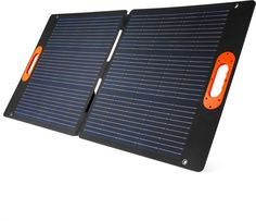 two pieces of black and orange solar panel with an orange button on each side,