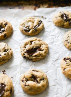 chocolate chip cookies on top of parchment paper