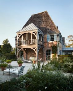 a large house with an outdoor seating area