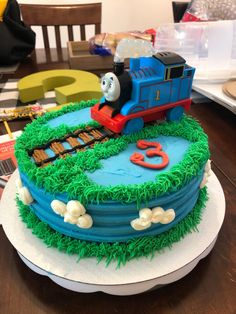 a thomas the train birthday cake on a table