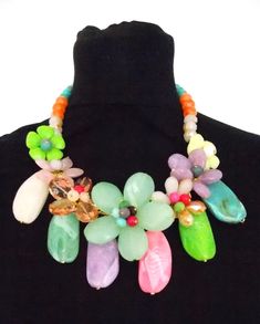 Stunning, chunky floral beaded statement necklace from Olivia Divine. Abalone shell and acrylic floral beaded necklace with large acrylic bead detailing. Beautiful, coloured floral style statement necklace. Adjustable length. Perfect for holidays, weddings and special occasions. Spring Multicolor Beaded Necklace For Party, Spring Party Multicolor Beaded Necklaces, Bohemian Multicolor Flower Necklace For Party, Colorful Statement Necklace, Chunky Choker Necklace, Chunky Choker, Estilo Hippy, Floral Tattoo Sleeve, Hippy Chic