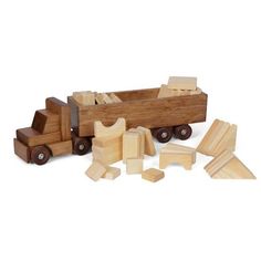 a wooden toy truck and pieces of wood