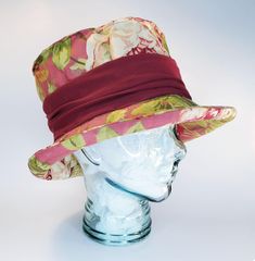 FREE SHIPPING - Satisfaction Guaranteed A soft top hat in romantic deep rose pink floral with cream, green and mustard with a burgundy knit band for a fit that's very comfortable for many many sizes.  The shape is achieved through design, a flexible plastic reed and stitching and it's crush-able and travels well. This is your next hat. This hat fits small to  large heads. Size 7 to 7 1/2  or 56 to 60 cm. This hat was hand made by a real milliner at the studio of Le Petit Chapeau, Orillia, ON. Canada. This hat is shipped in it's own hat box. How to Measure your head: It's very important to measure your head correctly.  There are a few things that you need. *A flexible measuring tape such as a dressmakers tape.  These can be found in any sewing/hobby shop, dollar stores, department stores an Red Top Hat With Flat Brim, Red Brimmed Costume Hat One Size, Red Brimmed Mini Hat, One Size Fits Most, Red Brimmed Hat Bands For Kentucky Derby, Red Brimmed Festival Costume Hats And Headpieces, Red Brimmed Mini Hat, Red Brimmed Costume Hats And Headpieces For Festivals, Red Brimmed Festival Costume Hat, Red Brimmed Costume Hat For Festival