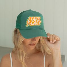 Take it Easy Patch Trucker Hat This his or hers trucker is part of our 2024 Originals Trucker Collection. Cute and perfect for your next day in the sun. So many fun and original styles to choose from! So light, medium/high profile and a perfect addition to your growing hat collection. 5 Panel Foam Mesh Back Trucker, Pro Style Adult Sizing 100% Poly Foam Front, 100% Nylon Back Designed and Finished in Sunny San Diego Green Flat Bill Trucker Hat For Beach, Fun Green Trucker Hat For Summer, Playful Adjustable Green Trucker Hat, Green Trucker Hat For Beach, Green 5-panel Trucker Hat For Beach, Lifeguard Hat, Toddler Accessories, Pool Floats, Hat Collection