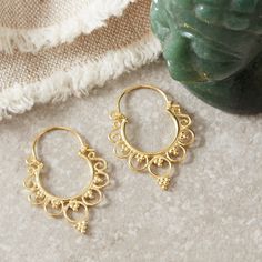 A lovely elegant and romantic style of Boho filigree gold hoops. The family I use for all my filigree jewellery have honed their skills for centuries in the far North of Thailand, Chang Mai region.  Super light weight and easy to wear, these can be matched with anything in your wardrobe for any occasion.  Sterling silver and 18k gold. All the materials I use are real Sterling Silver and 18 carat gold. I do not use inferior metals such as Gold fill or Brass Gold plated! A lovely all year round piece for yourself or a loved one! These earrings measure 3.2 cm in length. There are many handmade filigree earrings on my Etsy page, take a peek with the links below! Each item comes with a satin pouch. I can also present them in a gift box with tissue wrapping. Please select this option at the chec Yellow Gold Brass Hoop Earrings With Intricate Design, Brass Filigree Hoop Jewelry, Brass Filigree Hoop Earrings For Wedding, Ornate Gold Hoop Earrings For Festivals, Yellow Gold Filigree Hoop Earrings In Brass, Filigree Hoop Earrings For Weddings And Festivals, Wedding Festival Filigree Hoop Earrings, Ornate Gold Brass Hoop Earrings, Bohemian Hoop Earrings With Intricate Design For Wedding