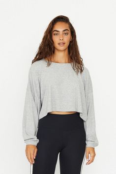 Product Details A statement oversized long-sleeve crop top, crafted from exceptionally soft small-ribbed modal fabric. This trendy piece features slouchy long sleeves, a casual crew neck, drop shoulder, and an oversized fit. Small contrasting logo on the chest. Ideal for effortless off-duty layering or wearing solo. Materials & Care Composition: 92% Modal, 8% Spandex Machine wash cold with like colors, do not bleach. wash inside out. Do not dry clean. Model is wearing size S. For more info pleas Oversized Long Sleeve Cropped Sweater For Loungewear, Relaxed Fit Long Sleeve Cropped Sweater, Long Sleeve Athleisure Tops For Everyday, Long Sleeve Cropped Sweater For Loungewear In Fall, Long Sleeve Cropped Sweater For Fall Loungewear, Long Sleeve Cropped Sweater For Fall, Athleisure Long Sleeve Cropped Sweater For Fall, Fall Long Sleeve Cropped Sweater For Loungewear, Gray Crop Top For Fall