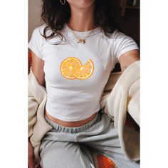 Embrace the vibrant nostalgia of Y2K with our Orange Slices Baby Tee, a flirty crop top reminiscent of coquette vintage fashion. Featuring a playful fruit print design, this girly-girl top is the perfect summer statement piece for women who adore retro charm.  🦢・️✩   ＊ Baby-style tee shirts ੈ༺☆༻*ੈ ᡣ𐭩PRODUCT DETAILS: - The heavy cotton tee is a KIDS SIZE SHIRT, so please size accordingly(using the chart provided).   ᡣ𐭩BABY TEE (YOUTH SIZE - Gildan Brand G5000B  - 100% ethically grown and harvested US cotton  - Midweight fabric (5.3 oz/yd² (180 g/m  *ੈ༺☆༻*ੈ  𐙚 SHIPPING:  - Processing time is 2-5 business days  *ੈ༺☆༻*ੈ ʚɞ SHOP POLICY:   - We do not accept returns and exchanges, but if you have received the wrong/damaged items or quality, send a message with photos, and we can find a solut Y2k Cropped Summer T-shirt, Y2k Summer Cropped T-shirt, Y2k Style Cropped T-shirt For Summer, Y2k Cropped T-shirt For Summer, Spring Y2k Crew Neck Crop Top, Spring Y2k Style Crew Neck Crop Top, Spring Y2k Crop Top With Crew Neck, Spring Y2k Style Crop Top With Crew Neck, Y2k Summer Cropped T-shirt With Short Sleeves