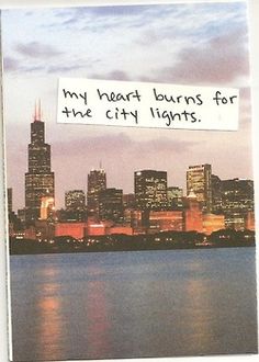 there is a sign that says, my heart burns for the city lights on it