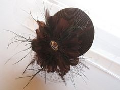 Chocolate Brown Straw Feather and Crystal Fascinator Hat with Veil and Crystal Headband, for wedding Vintage Mini Hats With Feathers For Party, Elegant Party Costume Hats And Headpieces With Feather Trim, Elegant Mini Hats With Feathers For Gifts, Elegant Mini Hats With Feathers As Gifts, Elegant Mini Hat With Feathers For Gift, Elegant Mini Hat With Feathers As Gift, Elegant Feathered Fascinator For Vintage Events, Elegant Feather Fascinator For Vintage Events, Elegant Mini Hats With Feather Trim For Party