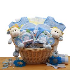 a basket filled with baby items on top of a wooden table