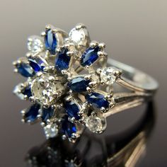 Metal:14k White Gold Weight:6.2 Grams Size:6.25 CTW:1.2 - 1.49 Carats 1 3.5mm round diamond 6 2.25mm round diamonds 12 3.5mm by 2mm marquise-cut sapphires, approx. 0.88 - 1.08 carats Make an offer! Dazzling Multi-stone Platinum Diamond Ring, Platinum Cluster Multi-stone Diamond Ring, Platinum Multi-stone Cluster Diamond Ring, Diamond White Marquise Multi-stone Ring, Marquise Multi-stone Diamond Ring, Diamond White Multi-stone Marquise Rings, Round Multi-stone Platinum Diamond Ring, White Gold Marquise Multi-stone Diamond Ring, Multi-stone Platinum Diamond Ring