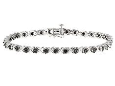 0.90ctw round black diamond, rhodium over sterling silver tennis bracelet. Measures approximately 7"L x 1/8"W and has a hidden box clasp. Black rhodium enhanced settings. Classic Round Black Diamond Bracelet, Classic Tennis Bracelet With Black Diamonds, Classic White Gold Diamond Bracelet With Black Diamonds, Classic Black Diamond Bracelet For Anniversary, Black Diamond Round Tennis Bracelet, Black Diamond Round Bracelet, Classic Black Diamond Bracelet With Diamond Accents, Classic Silver Tennis Bracelet With Black Diamonds, Black Diamond Bracelet With Diamond Accents