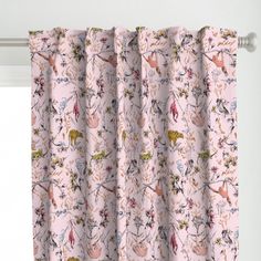 a pink curtain with flowers on it