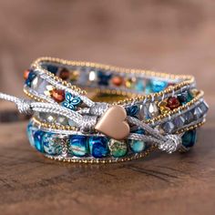 Get inspired by the charming nature with our new Moonbeam opal stone charm multilayered Leather wrap bracelet this Breathtaking wrap bracelet is carefully handmade from natural opal stones added on imperial jasper beads , adding a very unique magic inspired from the charming nature to your boho beautiful style . * Material : opal, butterfly, metal beaded chain, crystals, imperial stones, waxed cord. * Making Technics : handmade braided. * Size : Around 19 inches+3 closures. * Custom Service : Ac Turquoise Multi-strand Wrap Bracelet As Gift, Adjustable Natural Stones Wrap Bracelet, Elegant Multicolor Hand Wrapped Wrap Bracelet, Turquoise Wrap Bracelet Great For Gifts, Adjustable Wire Wrapped Magical Jewelry, Unique Multicolor Wrap Bracelet For Healing, Turquoise Wrap Bracelet Gift, Adjustable Multi-strand Spiritual Wrap Bracelet, Spiritual Healing Wrap Bracelet