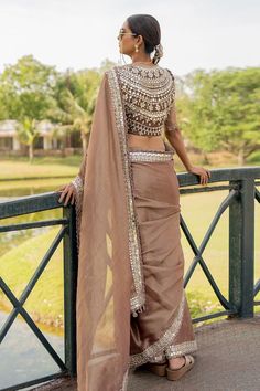 Bronze mirror embroidered hem saree. Paired with a potli button padded blouse and a mirror embroidered jacket. - Aza Fashions Mirror Blouse, Potli Button, Embroidered Hem, Padded Blouse, Bronze Mirror, Stylish Dress Designs, Embroidered Jacket, Raw Silk, Dress Designs