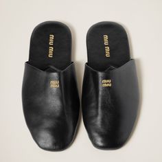 Find MIU MIU Leather Slippers on Editorialist. Upper with embossed logo Leather lining Screen-printed logo on the insole Rubber sole Leather insole Miu Miu Logo, Best Slippers, Heeled Mules Sandals, Suede Slippers, Beach Wear Dresses, Leather Shirt, Leather Slippers, Sand Beige, Leather Slides