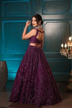 This jewelled purple lehenga features all over tonal sequin, crystal and cutdana embroidery. Paired with a strappy blouse with tassel string detailing and an embroidered dupatta in net.DELIVERY TIMEPlease allow 8-12 weeks for your outfit to arrive.FABRIC DETAILSNetProfessional cleaning only. Net Lehenga Designs Latest, Lehnga Designs Indian Weddings Simple, Unique Indian Outfits, Latest Lehnga Designs, Unique Lehenga Designs, Trendy Lehenga Designs, Lehenga Purple, Lehenga Designs Latest, Strappy Blouse